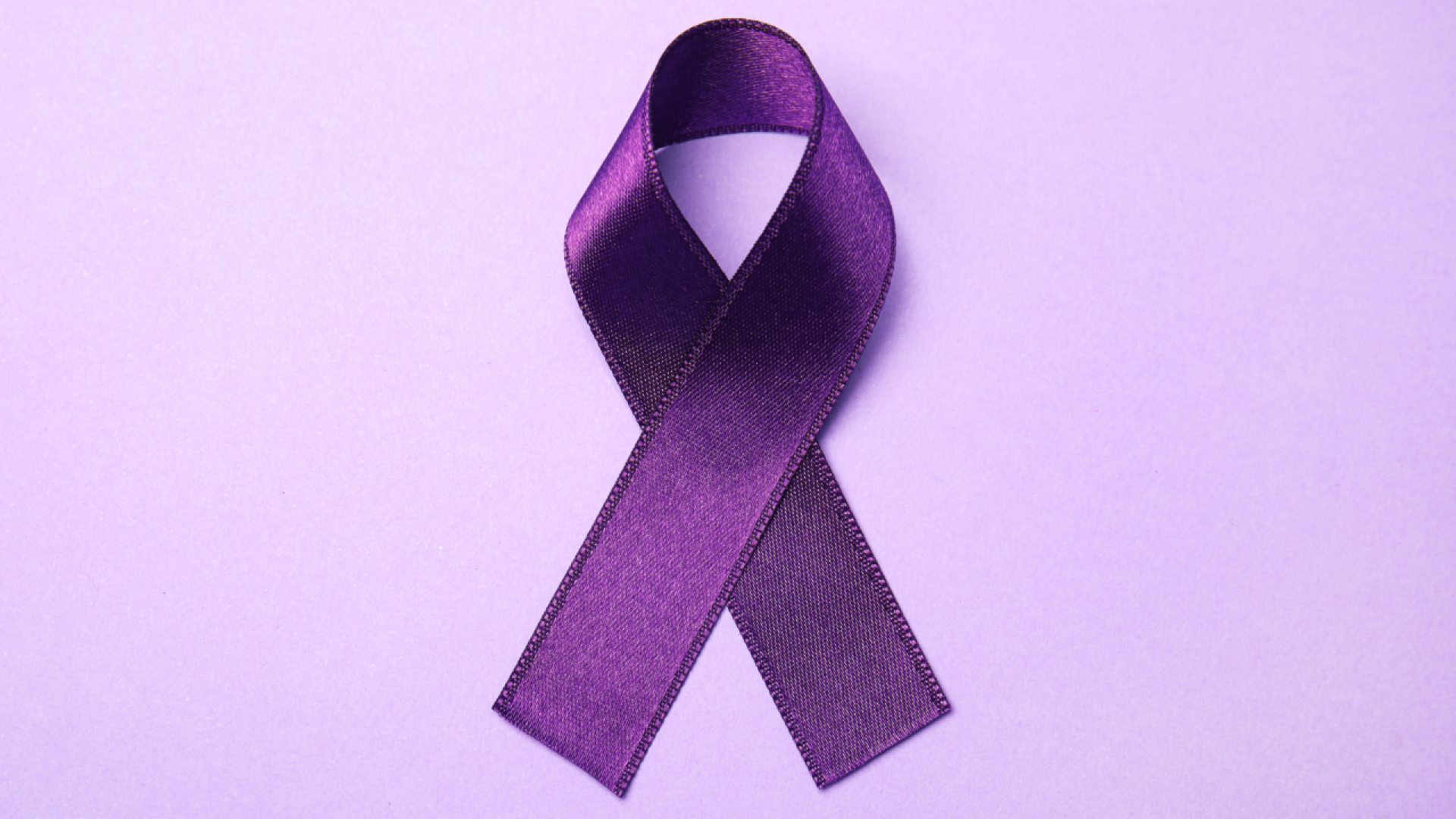 Purple ribbon on purple background
