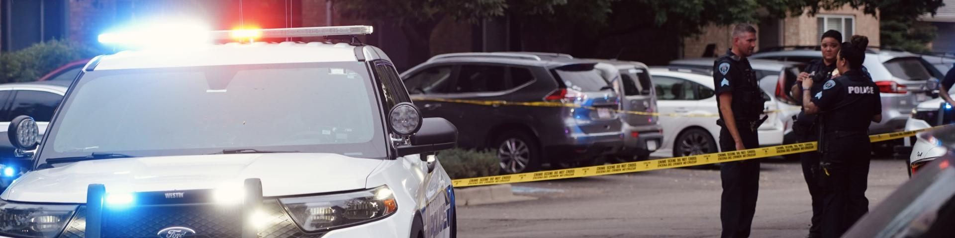 Thornton police vehicle in front of crime scene tape