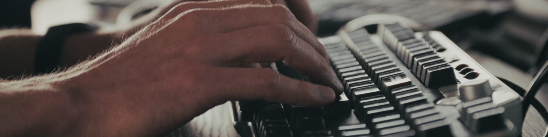 Hands typing on keyboard
