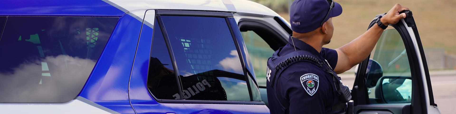 Patrol officer near vehicle