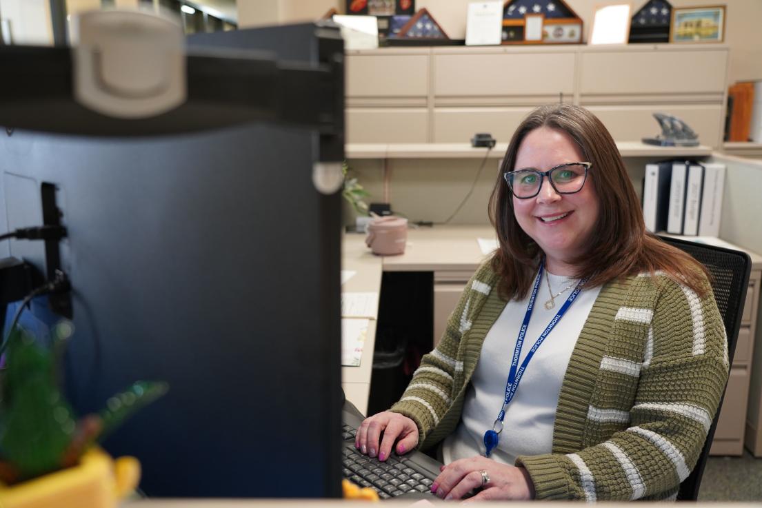 administrative supervisor sitting at computer