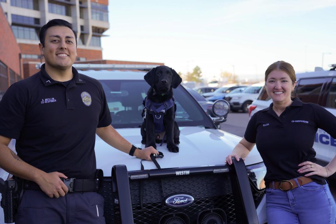 Co-responders and K9 in front of patrol car