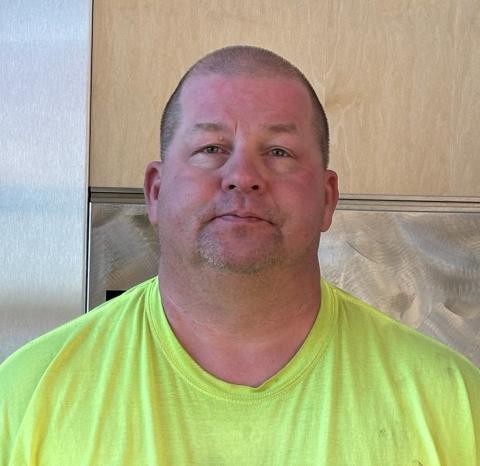 man in neon yellow tee shirt