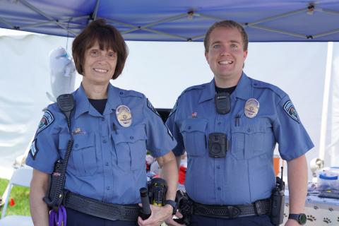 Animal control officers smiling at the camera