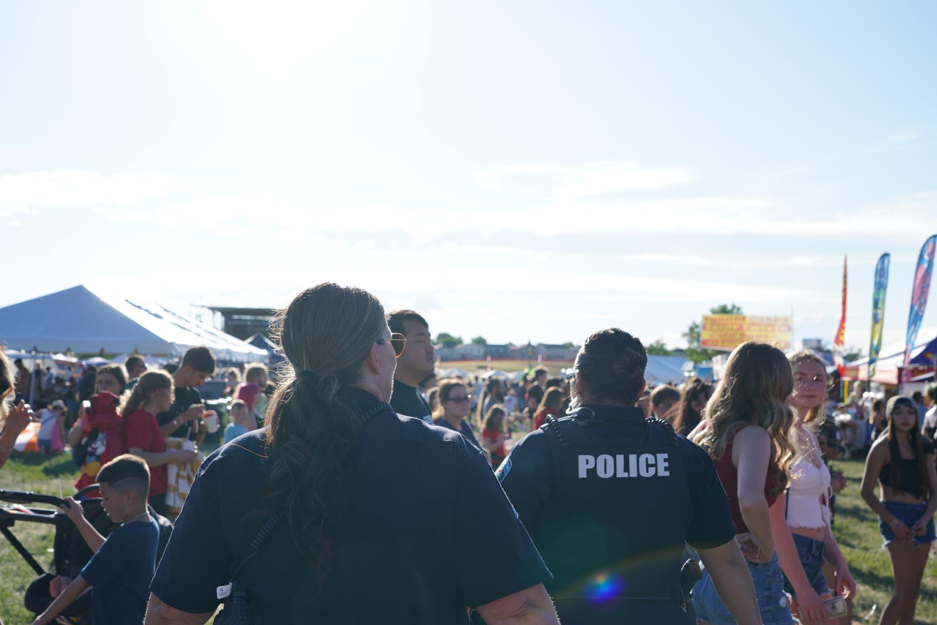 Officers walking at Carpenter Park during community event